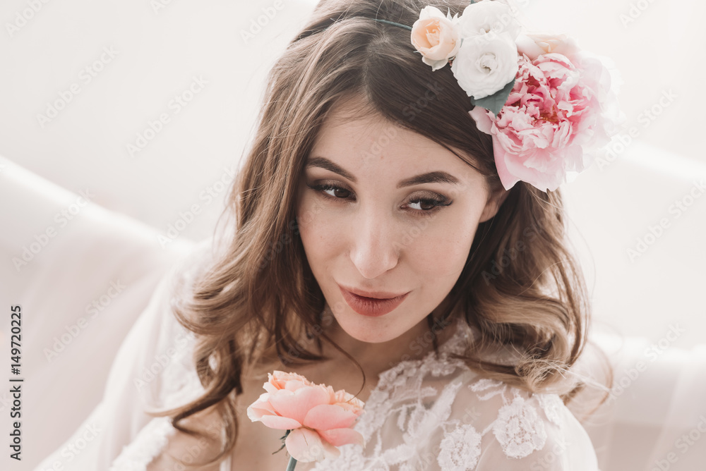 Portrait of young joyful girl with flowers in hair Portrait of young joyful girl with flowers in hair