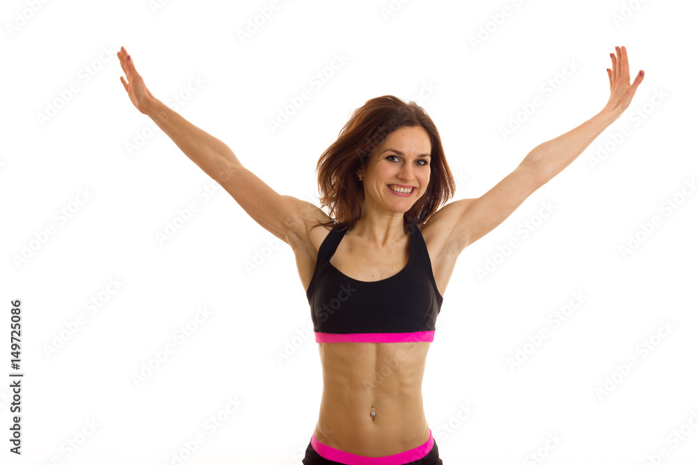 fun fitness girl with elastic tummy raised hands up fun fitness girl with elastic tummy raised hands up