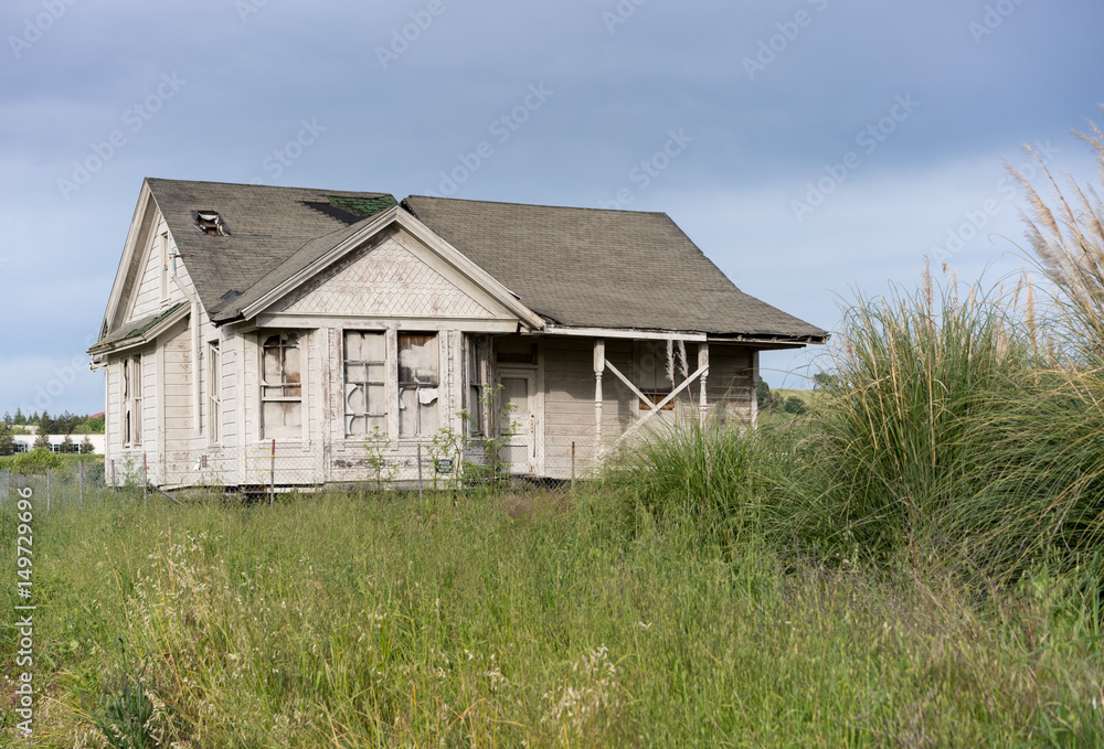 Abandoned single family home with wooden siding as fixer upper property Abandoned single family home with wooden siding as fixer upper property