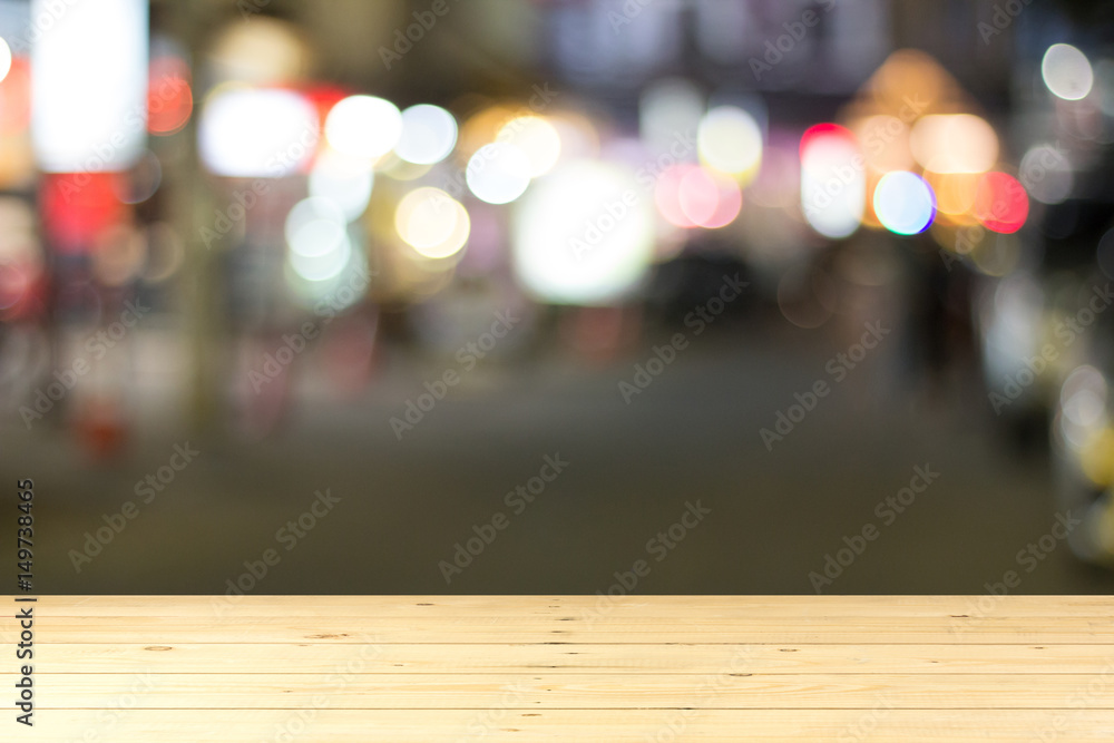 Wood tabletop with blurred city background
