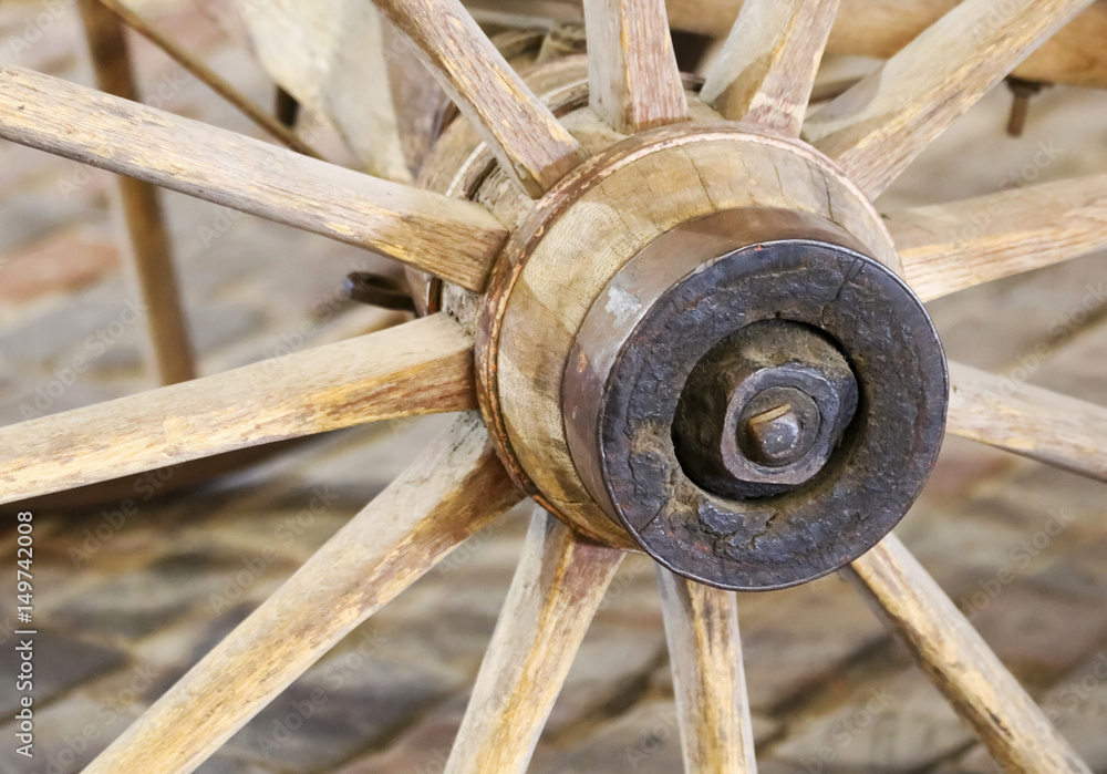 An Old Rusted Hub on a Wagon Wheel An Old Rusted Hub on a Wagon Wheel