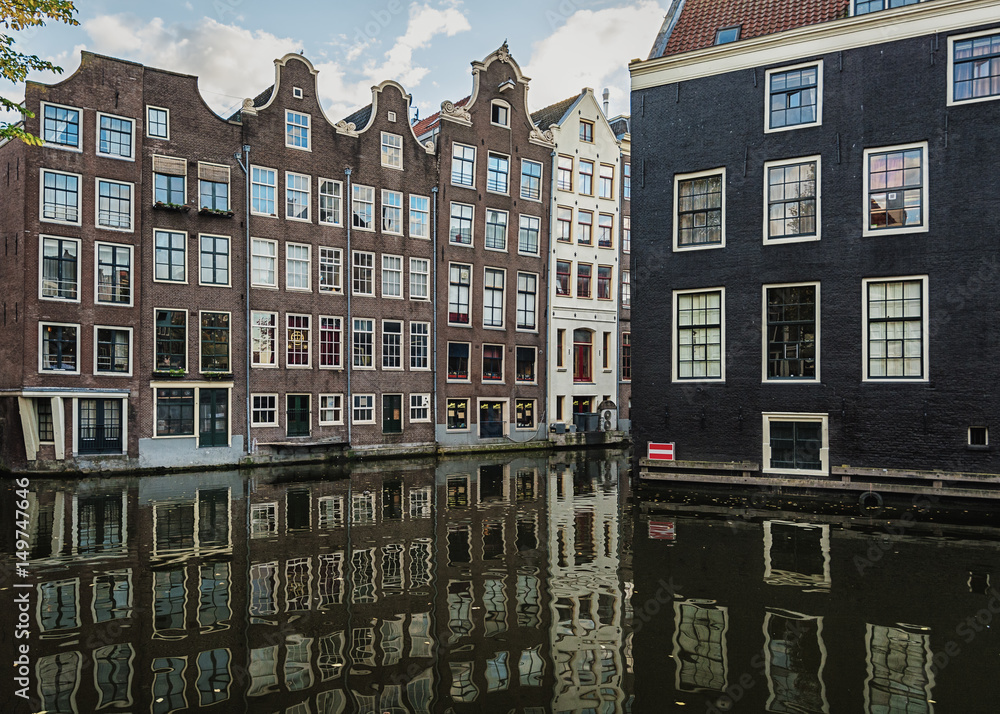 The canal houses along the junction of the canals Oudezijds Voorburgwal and Oudezijds Achterburgwal