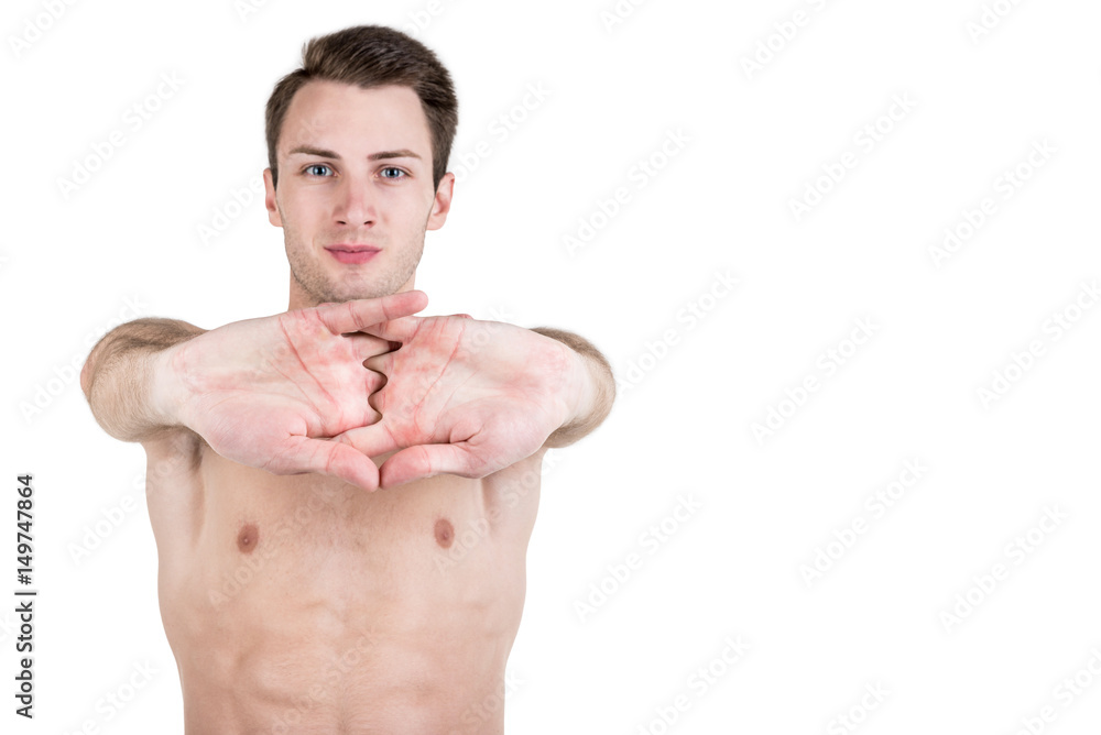 Fototapeta premium Healthy lifestyle. Portrait of a handsome guy with a sporty naked body, warming up, isolated on white background. Horizontal frame