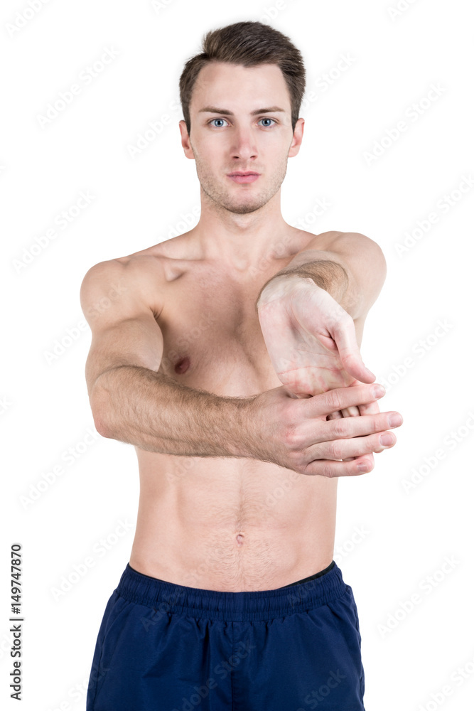 Healthy lifestyle. Portrait of a handsome guy with a sporty naked body, warming up, isolated on white background. Vertical frame Healthy lifestyle. Portrait of a handsome guy with a sporty naked body, warming up, isolated on white background. Vertical frame