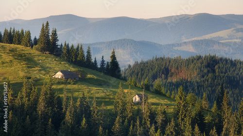 Landscape with small houses on the slopes of the Carpathian Mountains in Ukraine