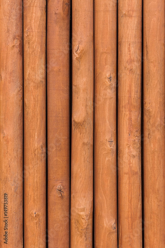 closeup, wooden fence with round columns, wood grain