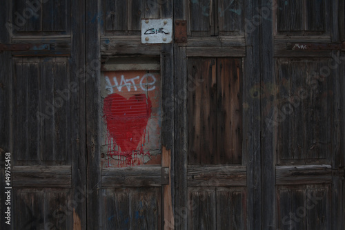 Graffiti heart on a door of wood