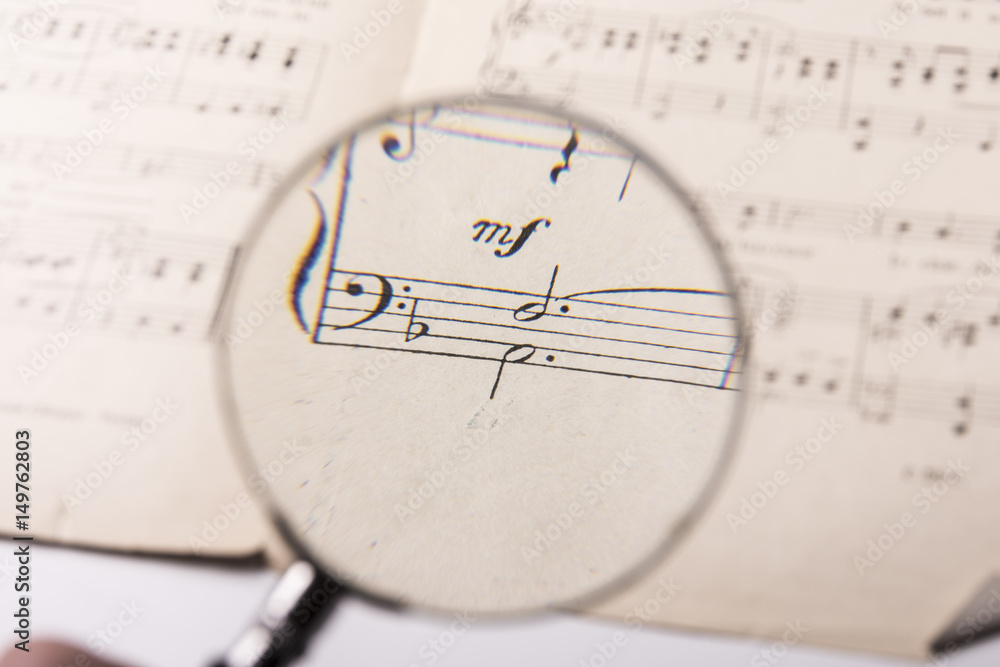 Fototapeta premium View through a magnifying glass of the notes in a music score
