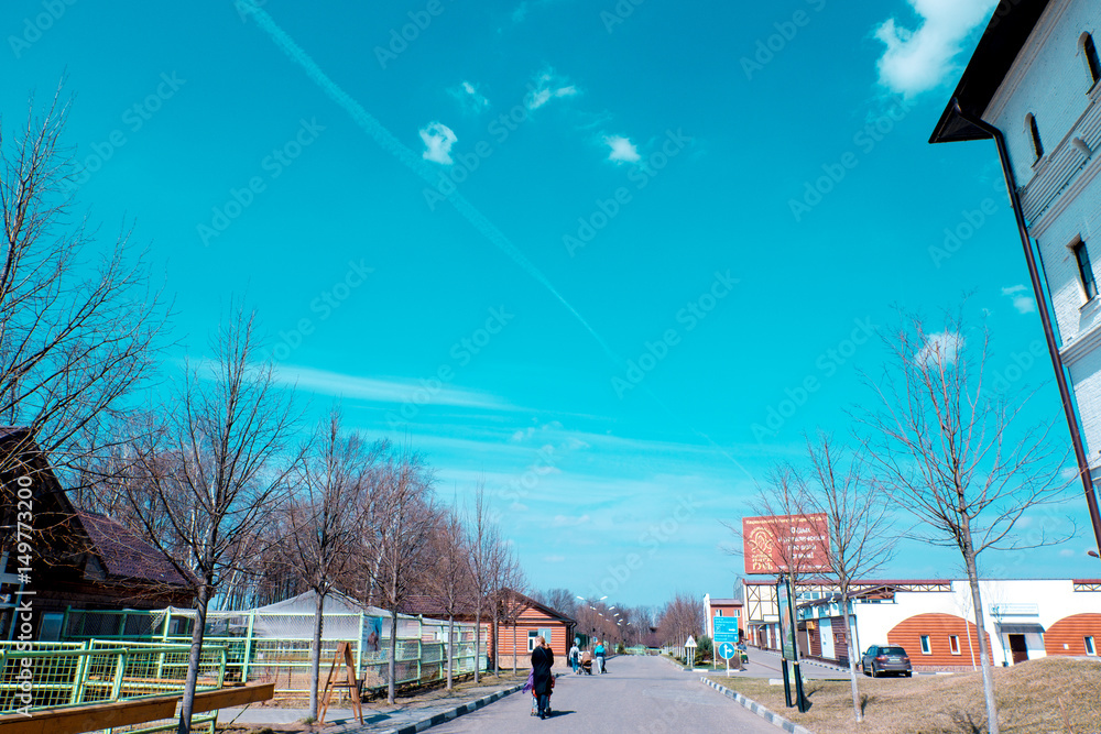 a young woman with a child girl walking at the horse Park in the spring came up standing at the horse feed a young woman with a child girl walking at the horse Park in the spring came up standing at the horse feed