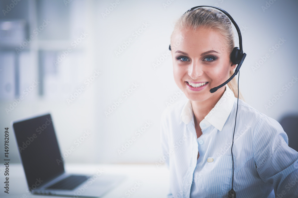 Close-up portrait of a customer service agent sitting at office Close-up portrait of a customer service agent sitting at office
