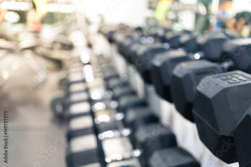 Blur abstract background of dumbbells in fitness.