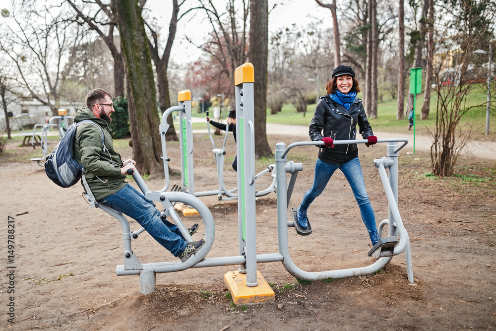 Friends of the tourists are training at sports and fitness in the park on the street public free gym Friends of the tourists are training at sports and fitness in the park on the street public free gym
