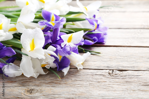 Fototapeta Naklejka Na Ścianę i Meble -  Bouquet of iris flowers on grey wooden table