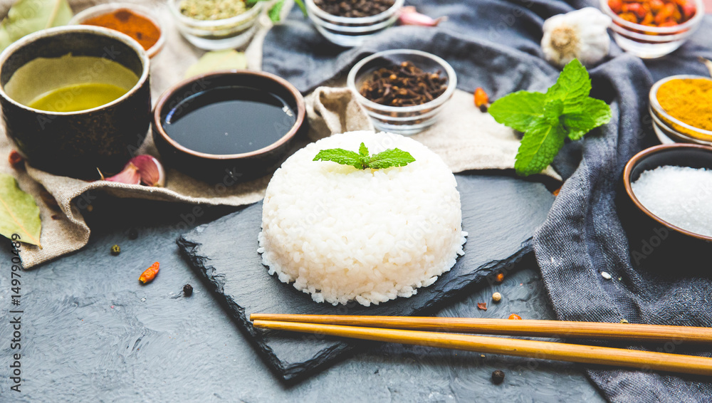 Boiled Dish Rice with vegetables and spices over dark rustic background. Vegetarian Asian food concept. Boiled Dish Rice with vegetables and spices over dark rustic background. Vegetarian Asian food concept.