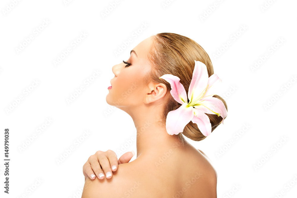 Beautiful spa woman with lily.