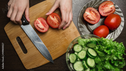 Tomato slice on wooden board, food cooking