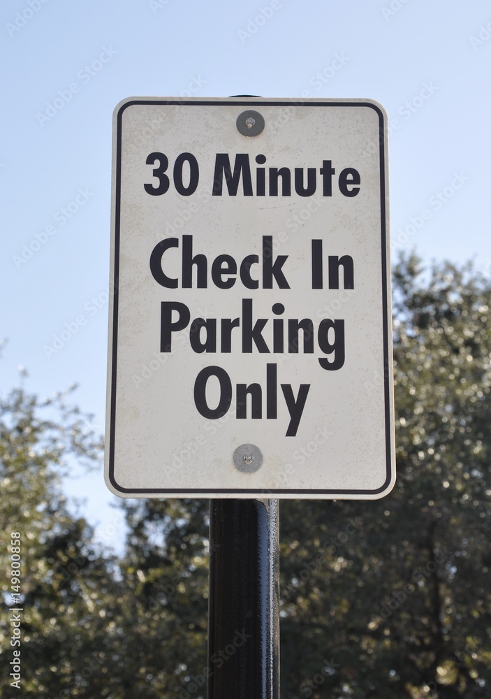 30 minutes check in parking only sign