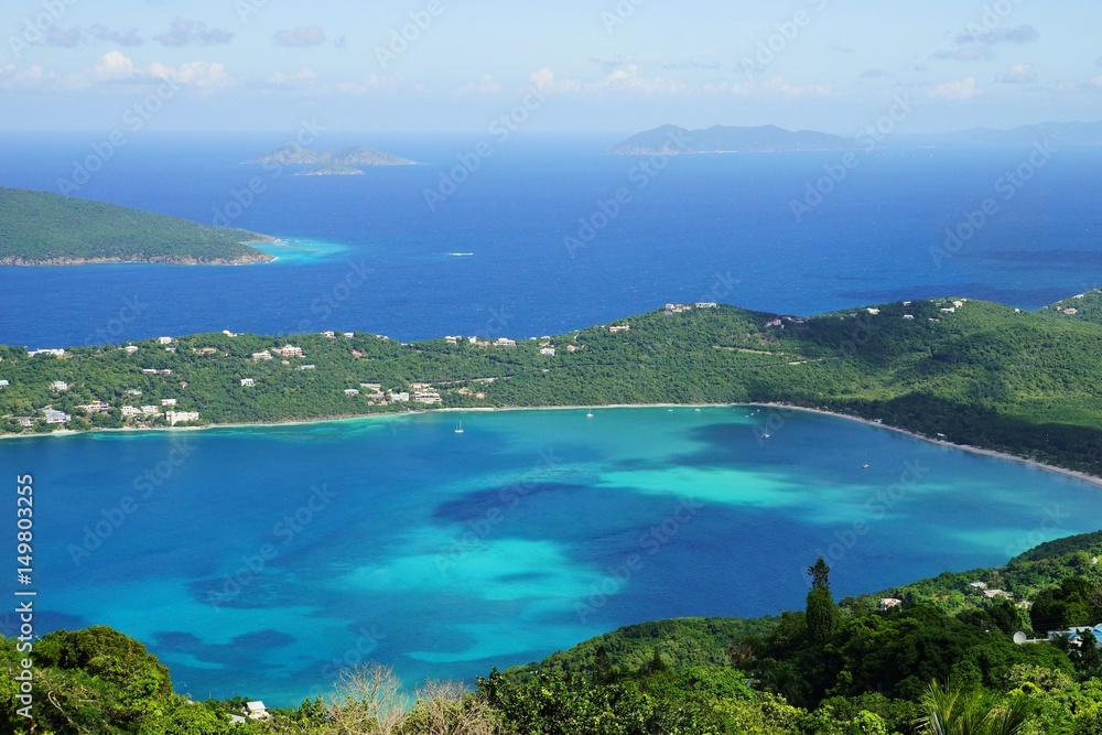 A high point view of Magens Bay, St. Thomas island with multiple other caribbean islands on the background