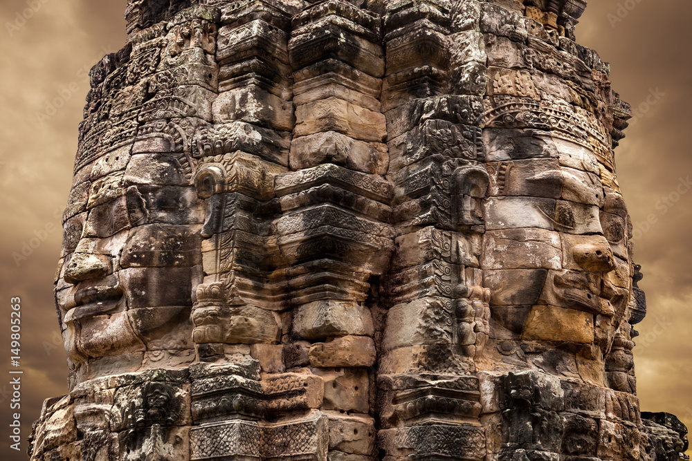 Stone faces of the famous Bayon temple in Angkor Thom complex, Siem Reap, Cambodia.