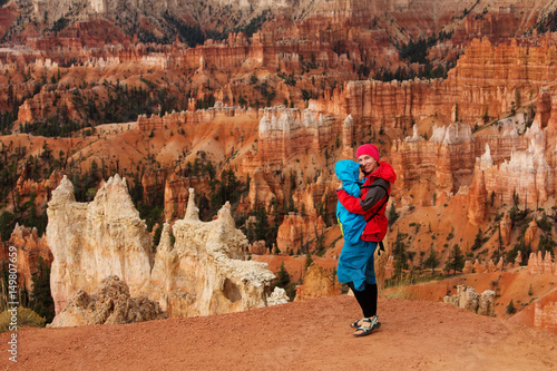 A woman with her baby boy are hiking in Bryce canyon National Park, Utah, USA
