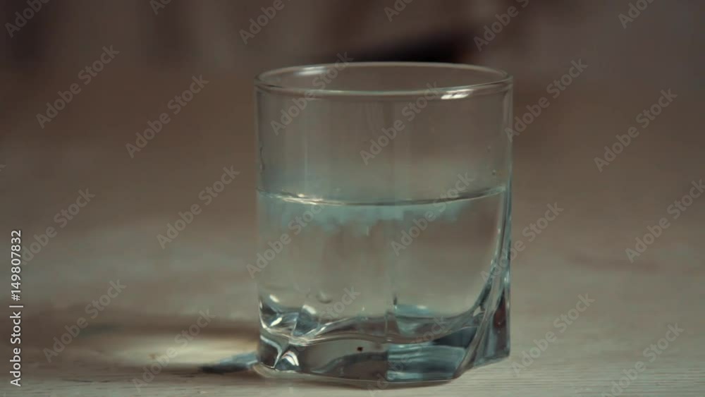 In a glass with water soluble medicine In a glass with water soluble medicine