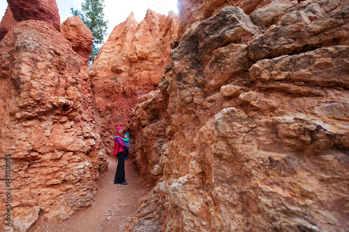 A woman with her baby boy are hiking in Bryce canyon National Park, Utah, USA