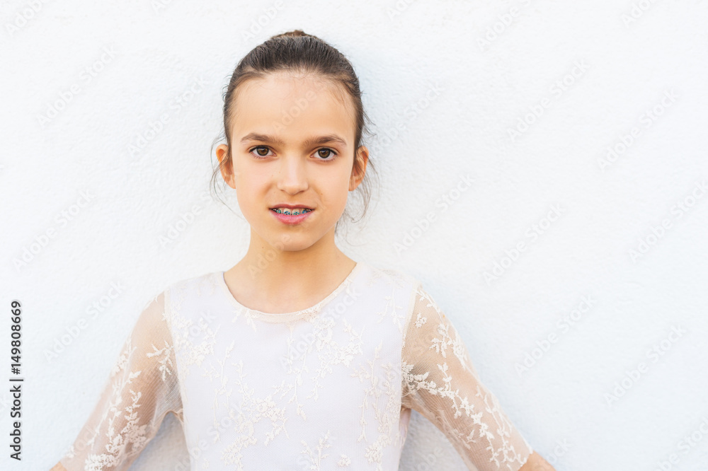 Preteen girl with teeth braces wearing beautiful dress Preteen girl with teeth braces wearing beautiful dress