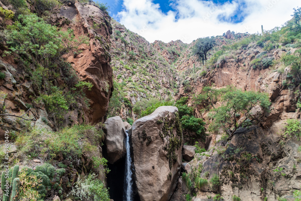 Tall waterfall in Quebrada del Colorado canyon near Cafayate, Argentina Tall waterfall in Quebrada del Colorado canyon near Cafayate, Argentina