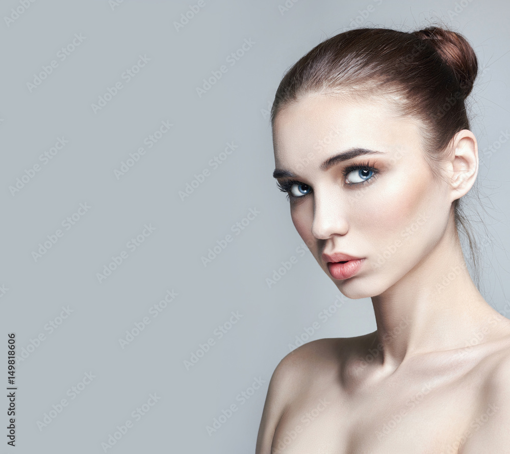 Obraz premium Pure perfect skin and natural makeup, skin care, natural cosmetics. Long eyelashes and big eyes. Beautiful attractive Nude woman. Natural makeup on a girl's face