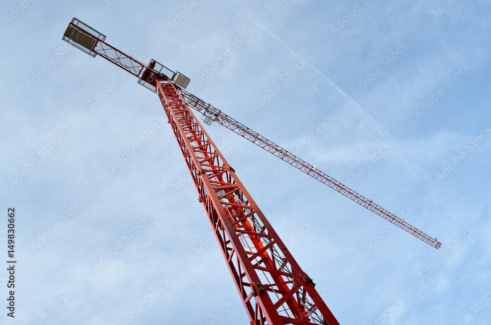 Red crane with sky in background, view from below Red crane with sky in background, view from below