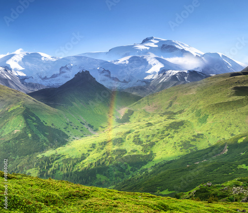 High mountain ridge in the day time. Panoramic landscape in the summer time