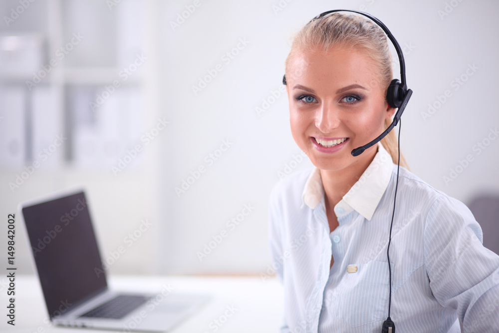 Close-up portrait of a customer service agent sitting at office Close-up portrait of a customer service agent sitting at office