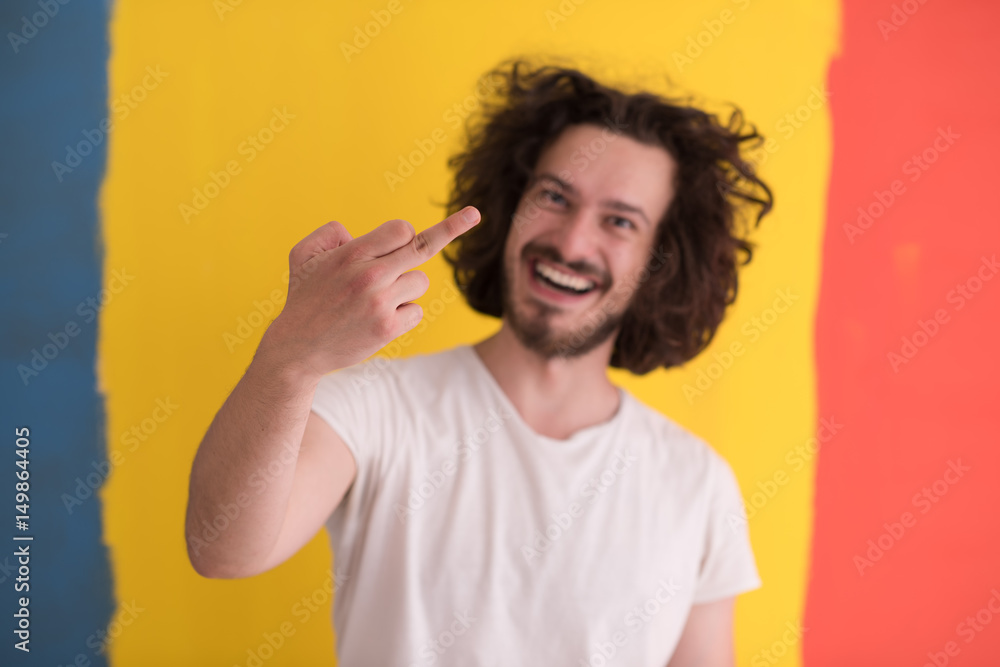 young man with funny hair over color background young man with funny hair over color background