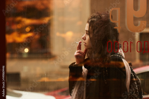 A girl smoking at a cafe of Saint Peterburg photo