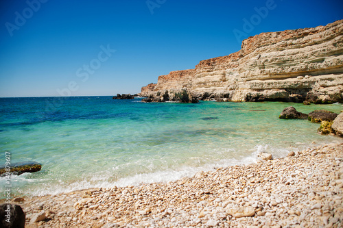 beautiful sea with turquoise water, and sandy beach at springtime.