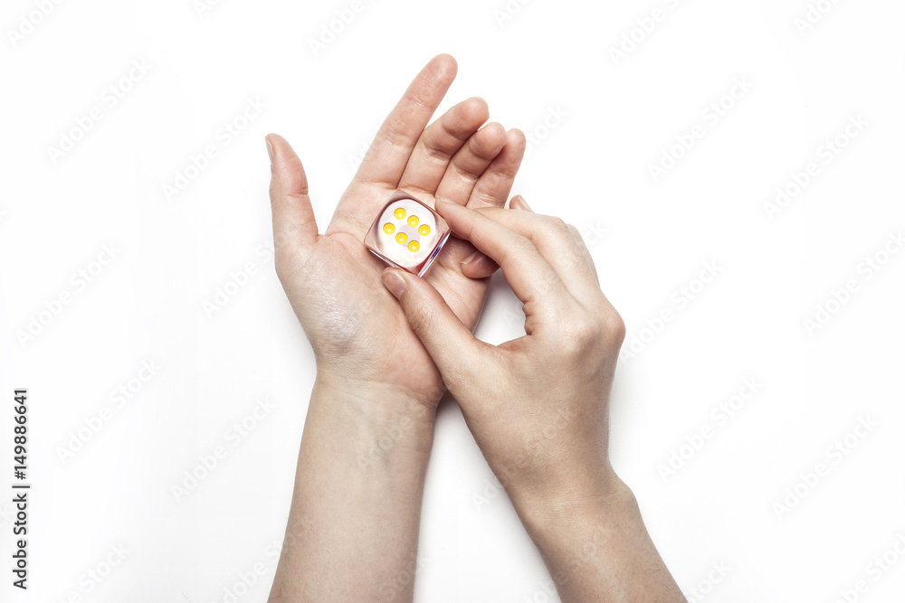 woman hand hold a dice isolated white. woman hand hold a dice isolated white.