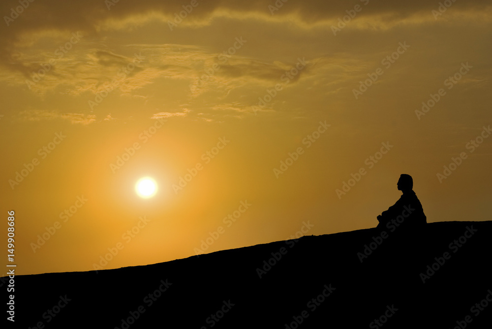 meditation under sunset