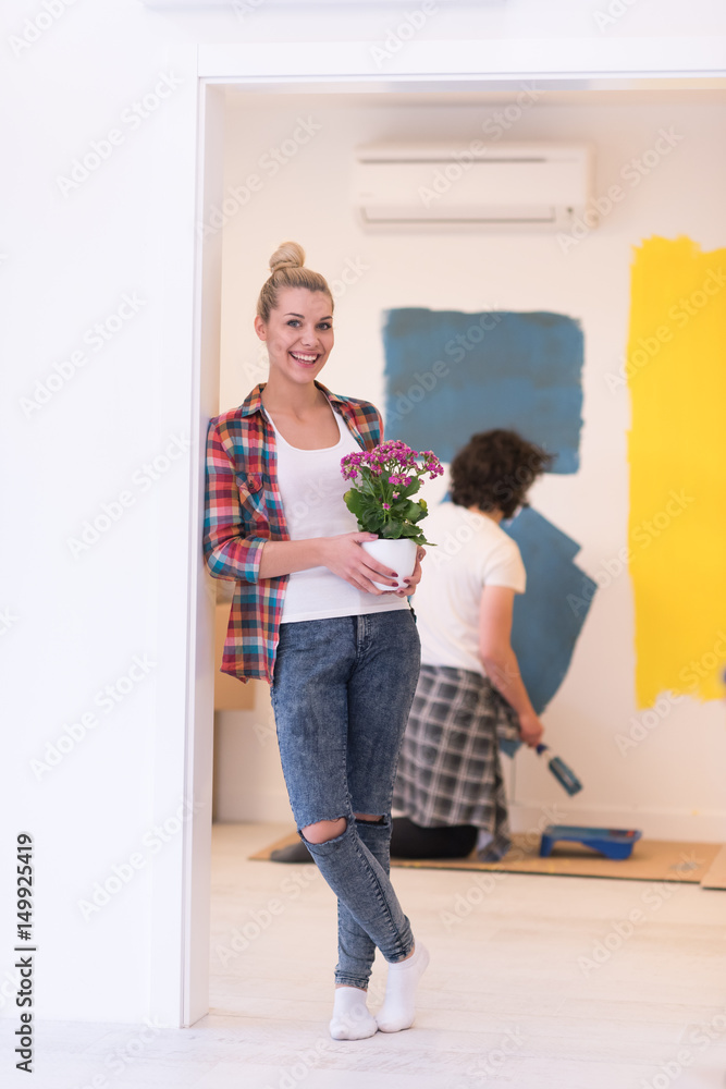 happy young couple doing home renovations
