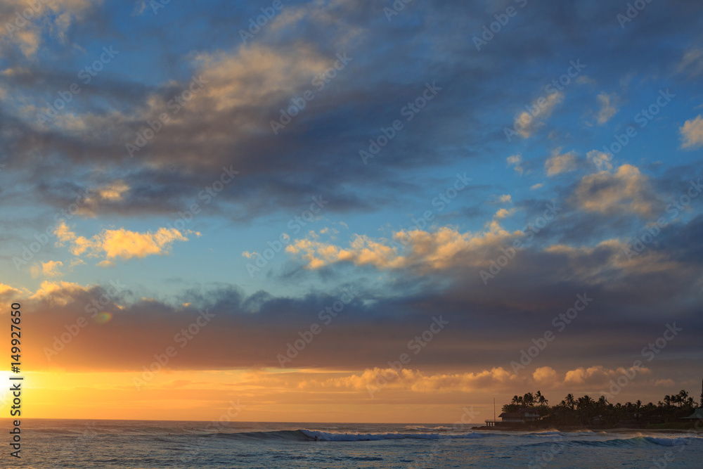 Beautiful ocean sunset with big waves in Hawaii