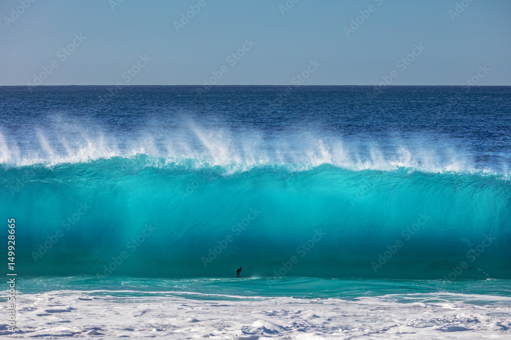 Fototapeta premium Blue ocean shorebreak wave for surfing sport activity. Template with nobody on background. Tropical summer scenery