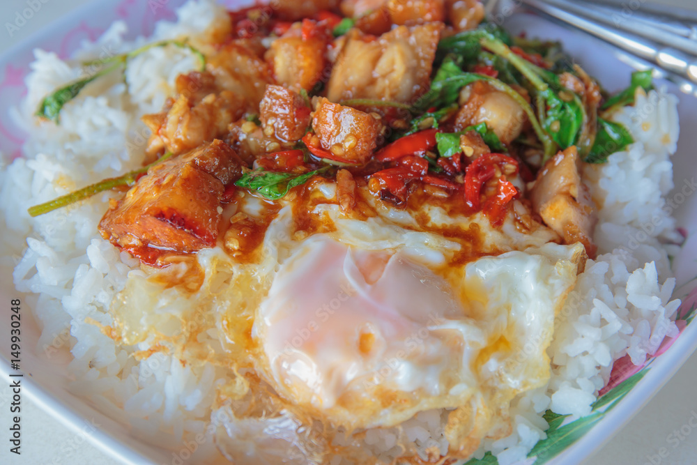Spicy crispy pork puff with basil and fried egg. Spicy crispy pork puff with basil and fried egg.
