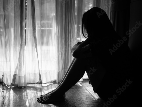 Obraz na plátne black and white of sad woman hug her knee and cry