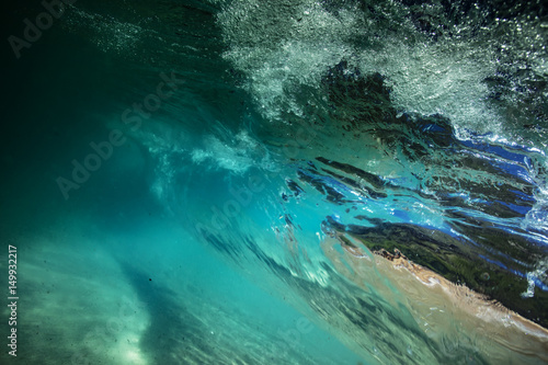 Underwater view from rolling ocean wave inside