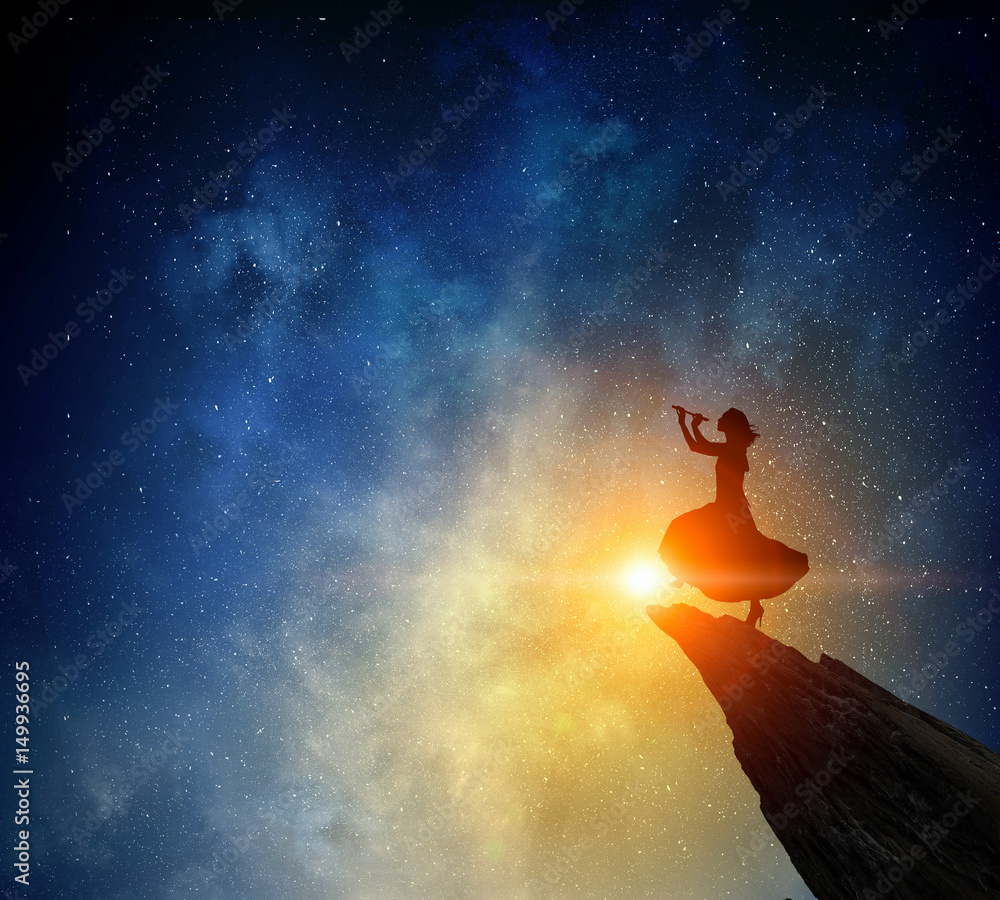 Fototapeta premium Businesswoman against starry sky . Mixed media