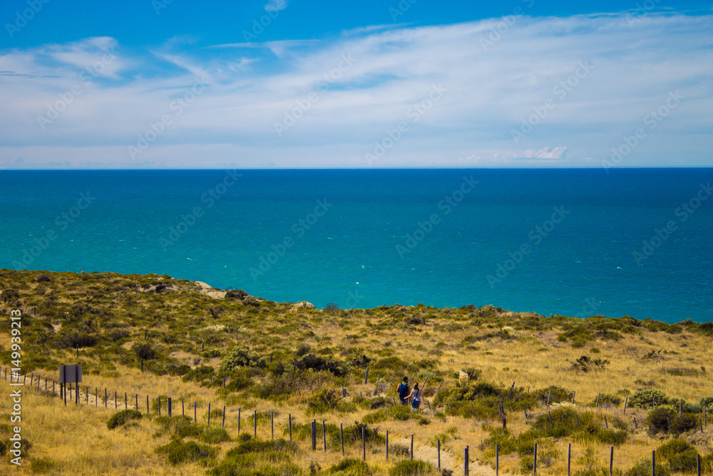 Couple doing hiking in the landscape of the Valdes peninsula in Patagonia Argentina - South America. Couple doing hiking in the landscape of the Valdes peninsula in Patagonia Argentina - South America.
