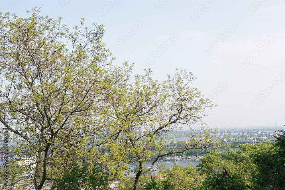 A bridge across the river, a city above the river. Spring A bridge across the river, a city above the river. Spring