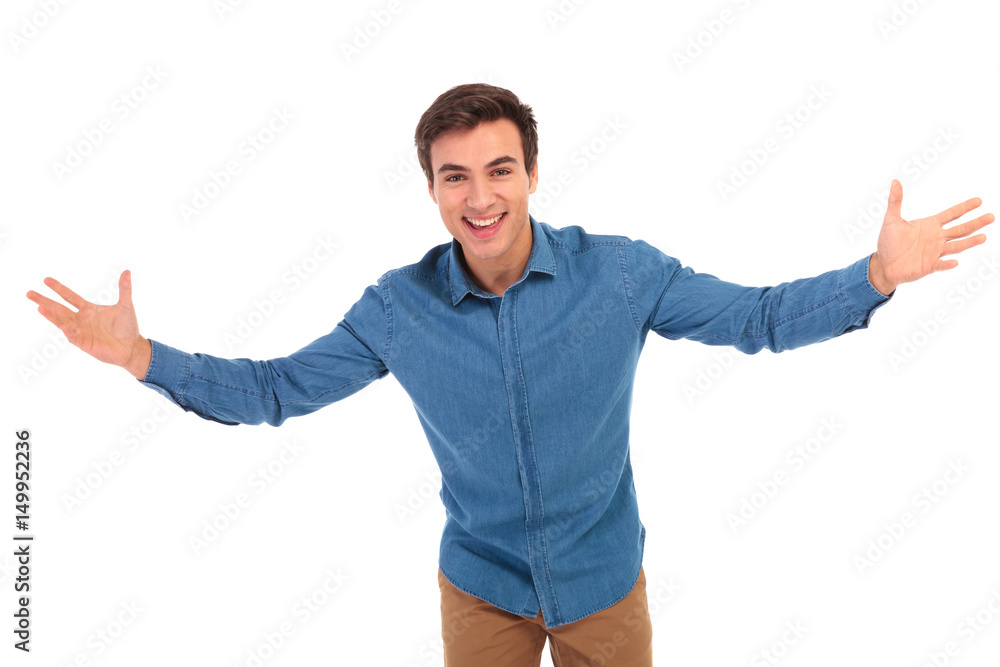 excited young casual man welcoming excited young casual man welcoming