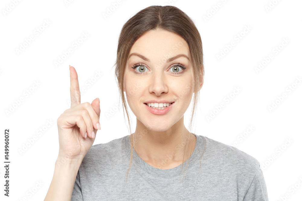Photo of energetic nice smiling lady wearing grey top isolated on white background pointing her finger in eureka sign, having great innovative idea, understanding or solution she has just got. Photo of energetic nice smiling lady wearing grey top isolated on white background pointing her finger in eureka sign, having great innovative idea, understanding or solution she has just got.