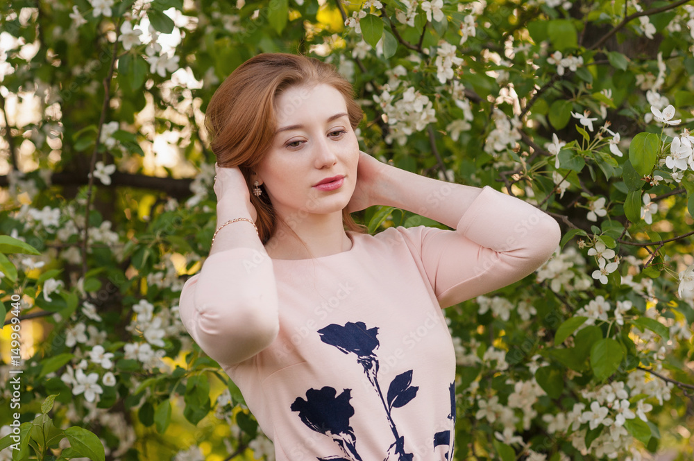 Beautiful Woman Fashion Model with Spring Blossoms Background Spring Beauty Woman with Apple Tree Flowers. Skin and hair care Beautiful Woman Fashion Model with Spring Blossoms Background Spring Beauty Woman with Apple Tree Flowers. Skin and hair care