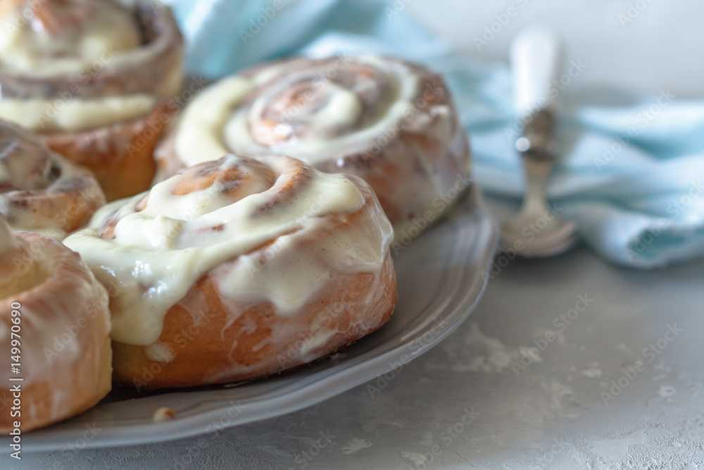 Homemade delicious cinnabon rolls with cinnamon and mascarpone frosting. Homemade delicious cinnabon rolls with cinnamon and mascarpone frosting.